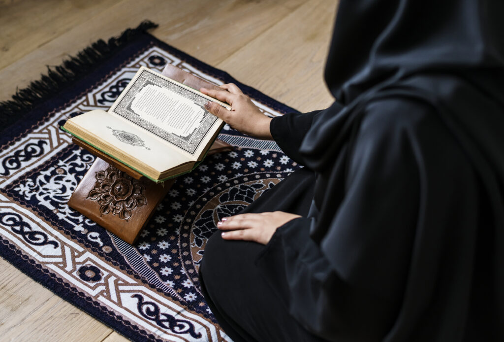 muslim woman reading from the quran